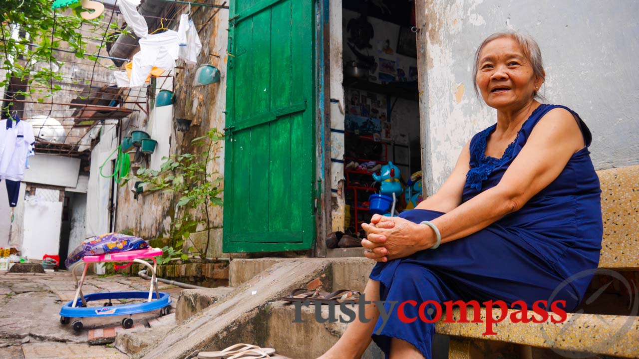 Three generations living country-style in the middle of downtown Saigon. Three generations living country-style in the middle of downtown Saigon.